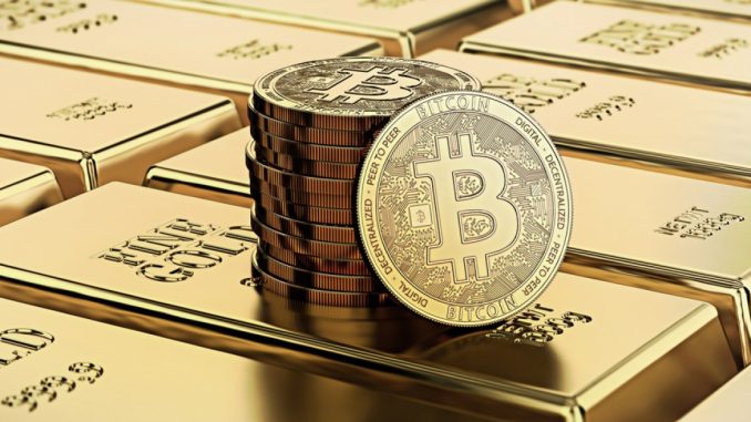 Picture of bitcoins sitting on top of a stack of gold bricks